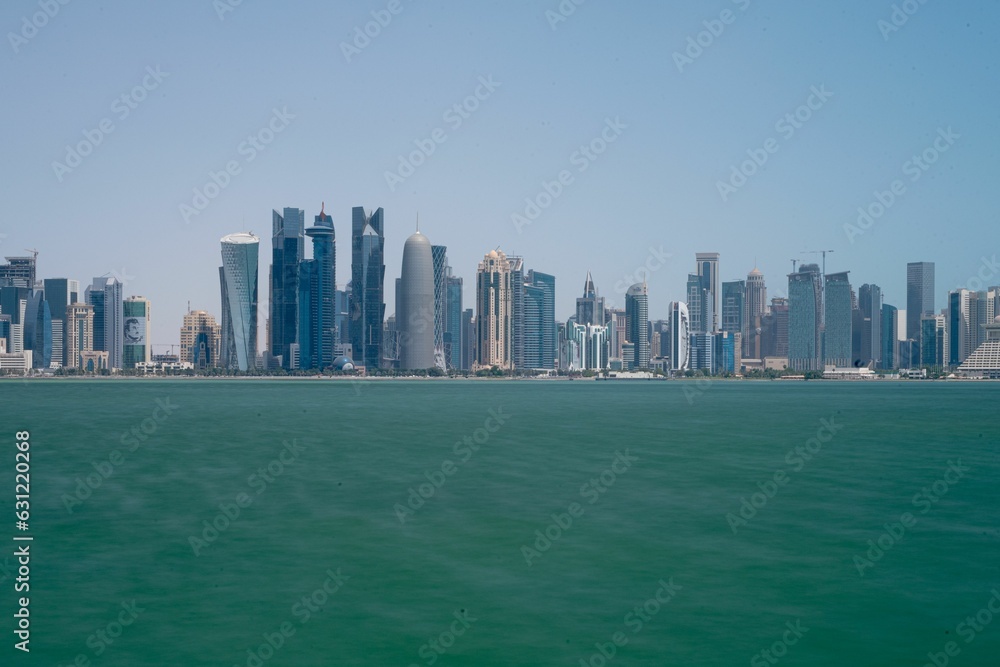 Stunning view of the cityscape of Doha, Qatar against the blue sky in summer