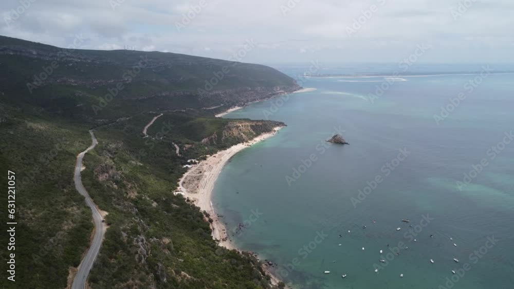 the beach nextt to Convent of Our Lady of Arrabida in Arrabida Natural Park, Portinho da Arrabida, foggy, grey weather, Portugal, drone top view the beach nextt to Convent of Our Lady of Arrabida in Arrabida Natural Park, Portinho da Arrabida, foggy, grey weather, Portugal, drone top view
