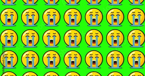 sad crying emoji over green background.  Emoticon sign. Emoji button. Looped with removable single color chroma background.