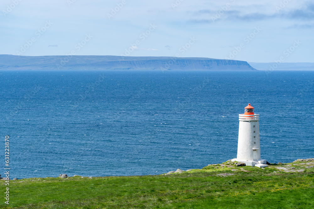Skardsviti Lighthouse along the edge of a cliff on a sunny day near Hvammstangi, Iceland Skardsviti Lighthouse along the edge of a cliff on a sunny day near Hvammstangi, Iceland