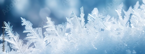 Beautiful crystals of hoarfrost close-up macro on a natural atmospheric blue background. Winter snow background © Eli Berr