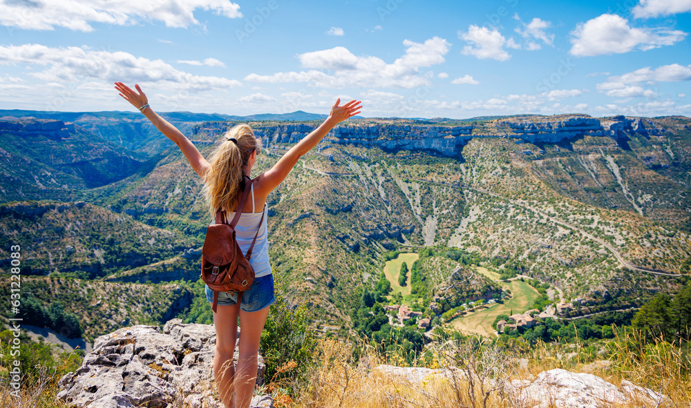 Hiker woman enjoying panoramic view of Cirque de Navacelles- Occitanie, South of France-Larzac-tourism,hiking, adventure concept Hiker woman enjoying panoramic view of Cirque de Navacelles- Occitanie, South of France-Larzac-tourism,hiking, adventure concept