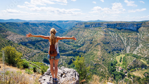 Woman traveler in mountain and canyon- Cirque de Navacelles- Travel, tourism,active life,adventure concept photo