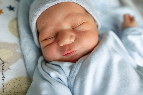 Newborn baby sleeping. Close up portrait of cute little boy.
