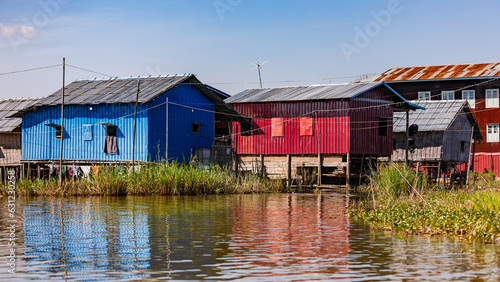 Traditional houses on stilts in the water of Inle Lake in Myanmar, Asia photo
