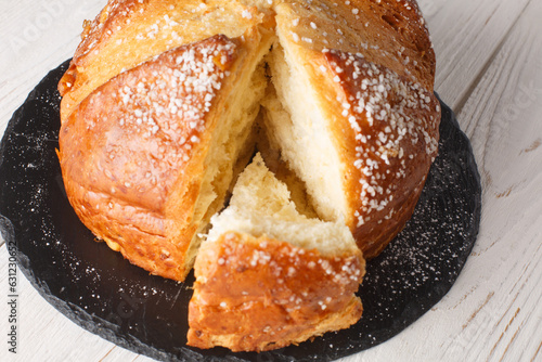 Orange Anise Sugared Easter Brioche Mouna closeup on the wooden table. Horizontal photo