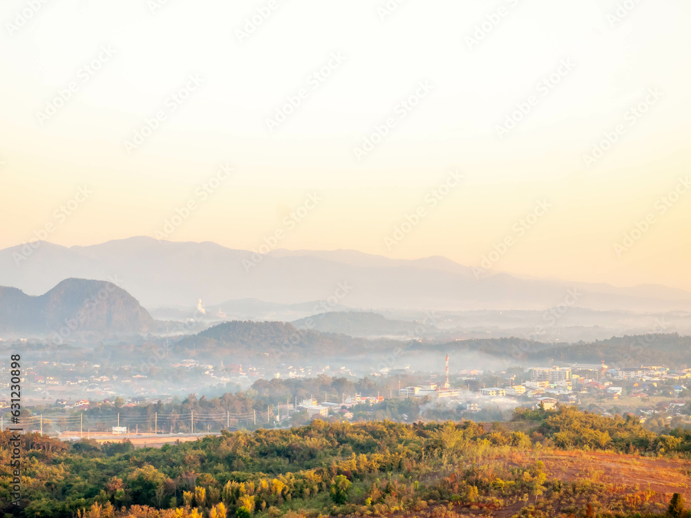 Obraz premium Natural viewpoint, mountains, hills, forests and river under morning mist in Chiangrai, Thailand