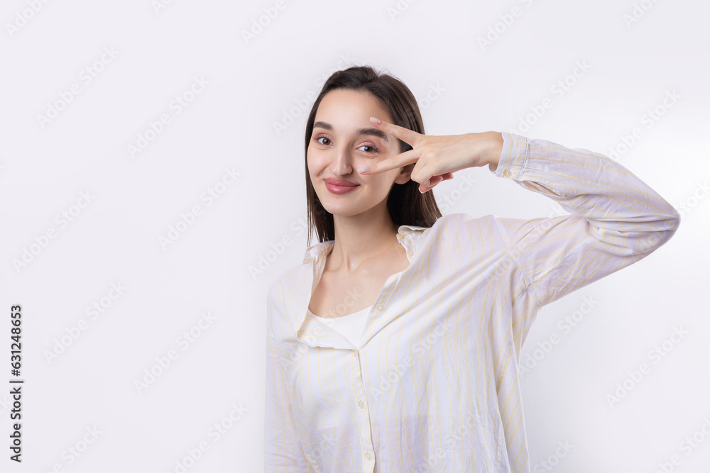 Smiling woman raised her hand palm up and forward like waving. Smiling woman raised her hand palm up and forward like waving.