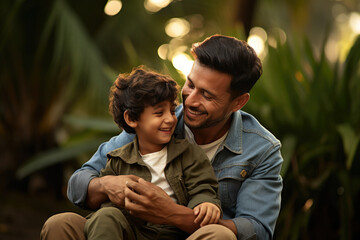 Indian young father and small kid playing, cuddling, flying plane, floating boat