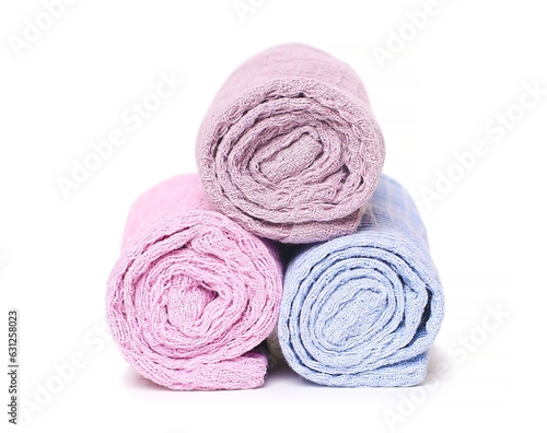Rolled towels on white background
