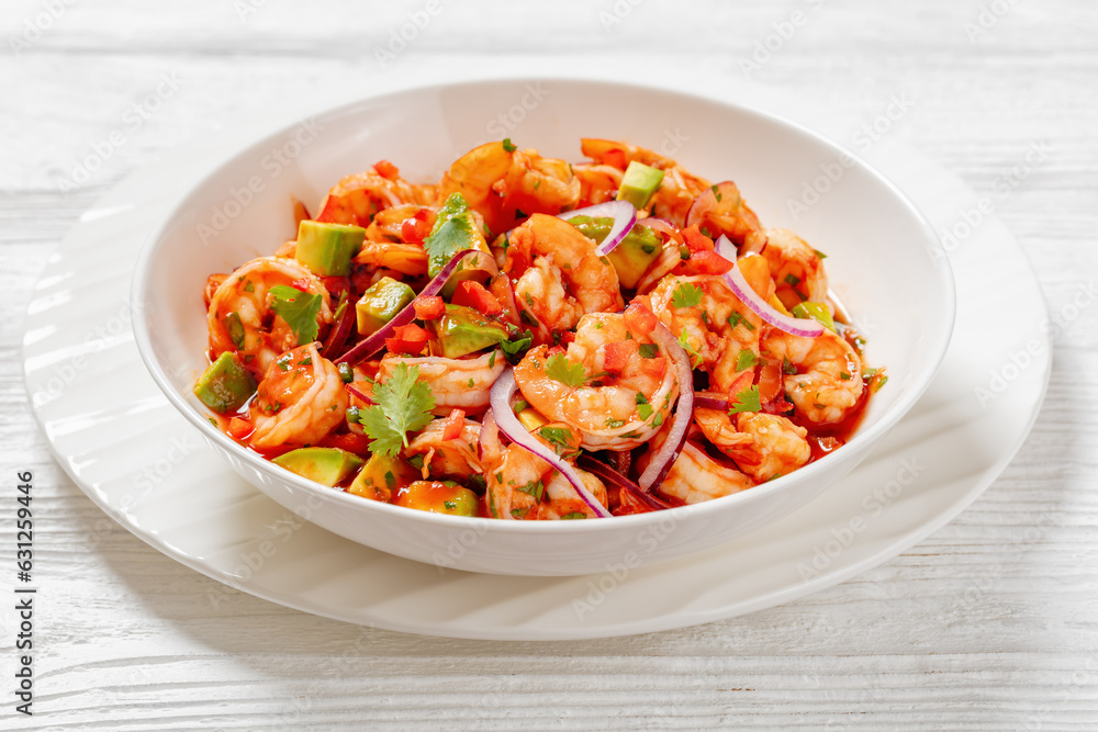 mexican shrimp cocktail salad in a bowl, top view mexican shrimp cocktail salad in a bowl, top view