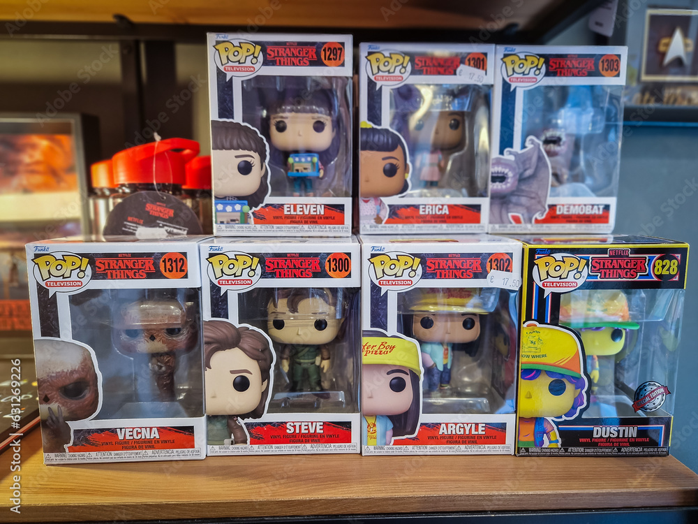 Fototapeta premium Tallinn, Estonia - July 11, 2023: Funko POP stranger things popular movie character toys on a shelf. Funko Inc is American company that manufactures licensed and limited pop culture collectibles.