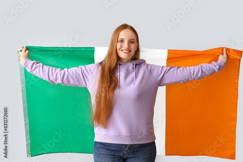Happy young woman with flag...