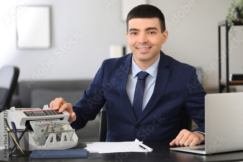 Male bank manager working w...