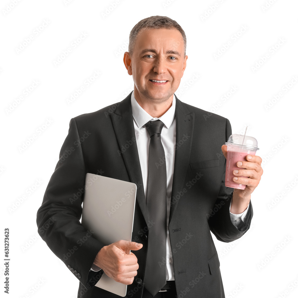 Mature businessman with glass of fruit smoothie and laptop on white background Mature businessman with glass of fruit smoothie and laptop on white background