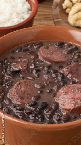 Typical brazilian feijoada with kale, rice and cracklings photo