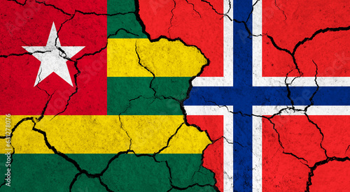 Flags of Togo and Norway on cracked surface - politics, relationship concept
