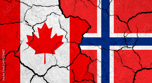 Flags of Canada and Norway on cracked surface - politics, relationship concept