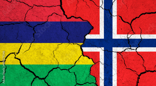 Flags of Mauritius and Norway on cracked surface - politics, relationship concept