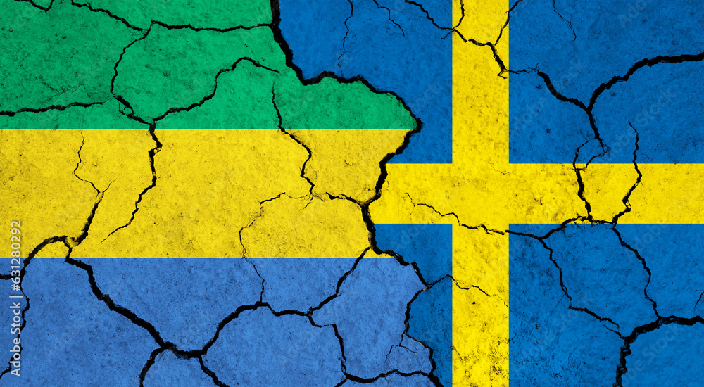 Flags of Gabon and Sweden on cracked surface - politics, relationship concept