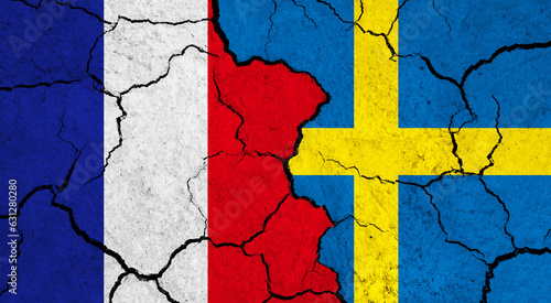 Flags of France and Sweden on cracked surface - politics, relationship concept