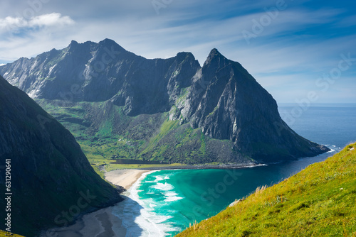 View over the turquoise water of Kvalvika Beach from Ryten Mount, Lofoten Islands, Norway