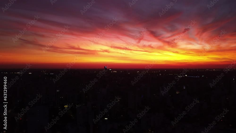Panorama of the night city of Buenos Aires, orange-pink sky, softly moving camera, drone Panorama of the night city of Buenos Aires, orange-pink sky, softly moving camera, drone