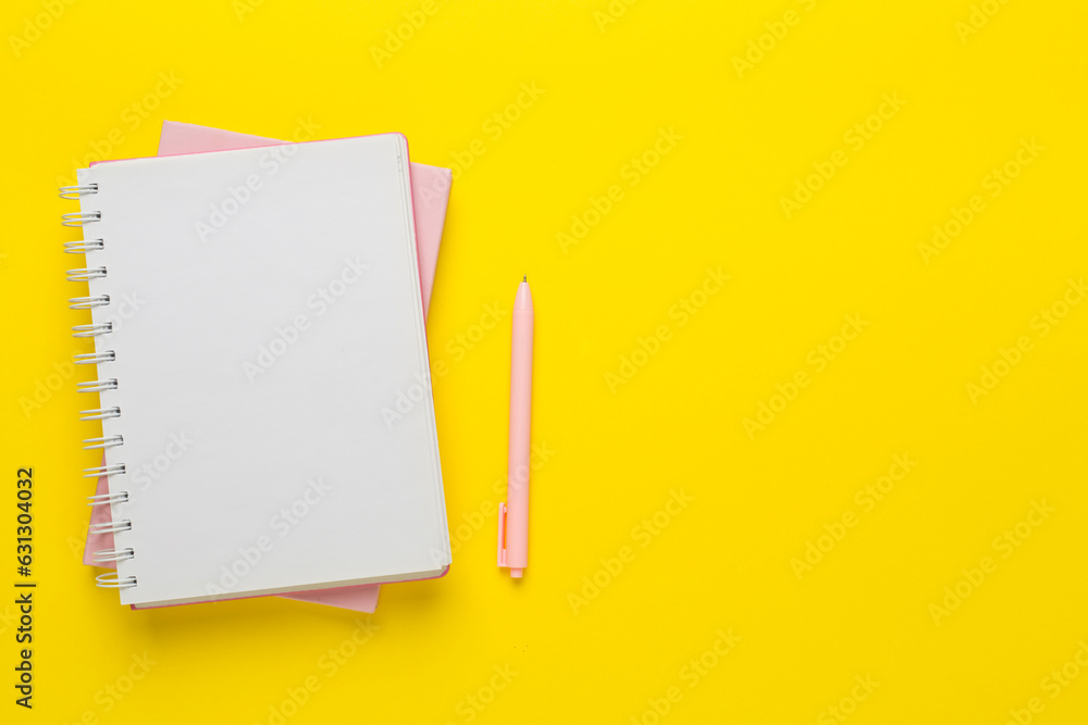Notebooks with stationery on color background, top view Notebooks with stationery on color background, top view