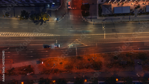 Bird's eye view taken from a drone at night - panoramic view of a night city in a European city, Bratislava ( Slovakia ) with night traffic and streetlights