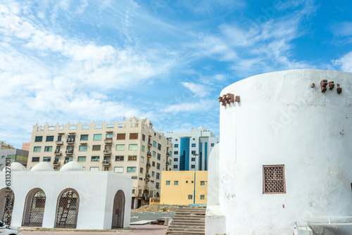 Al-Balad old town fortress remains with modern buildings, Jeddah, Saudi Arabia photo