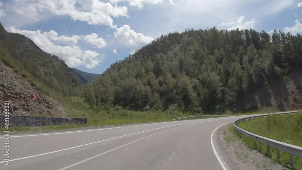 Video of driving in a car In summer season along the mountain road in Altai. Video of driving in a car In summer season along the mountain road in Altai.