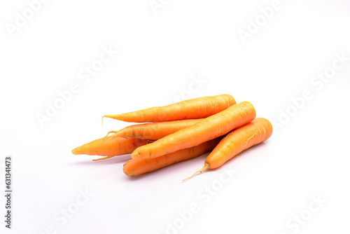 A pile of fresh carrots is isolated on a white background with copy space
