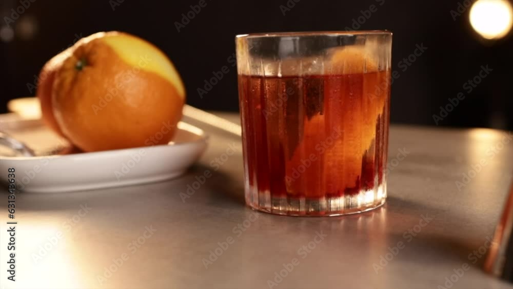 Close-up a glass of Negroni cocktail on a bar