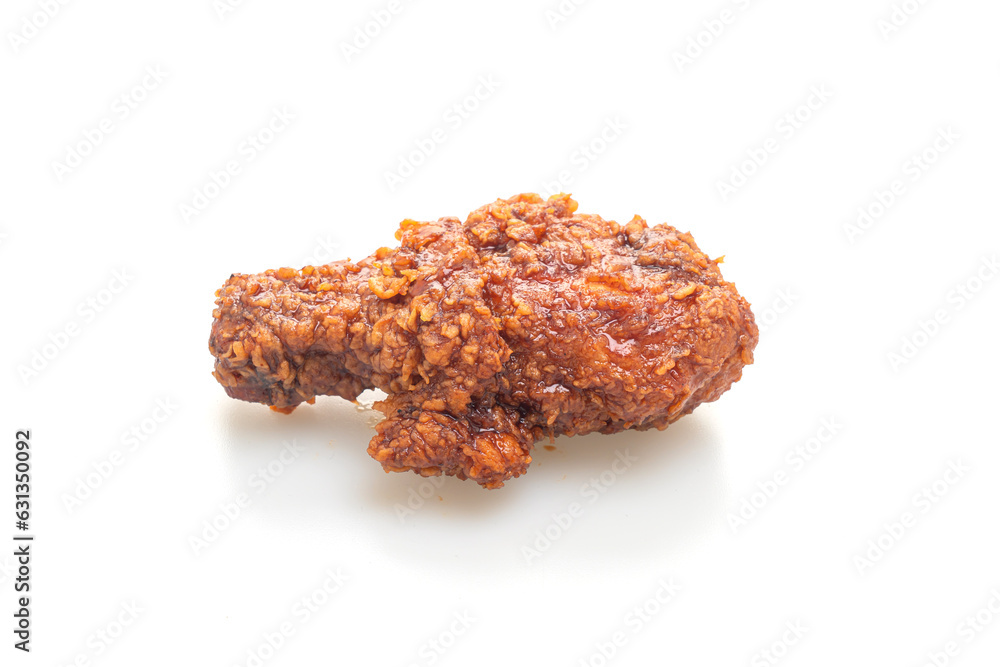 fried chicken with spicy Korean sauce on white background fried chicken with spicy Korean sauce on white background