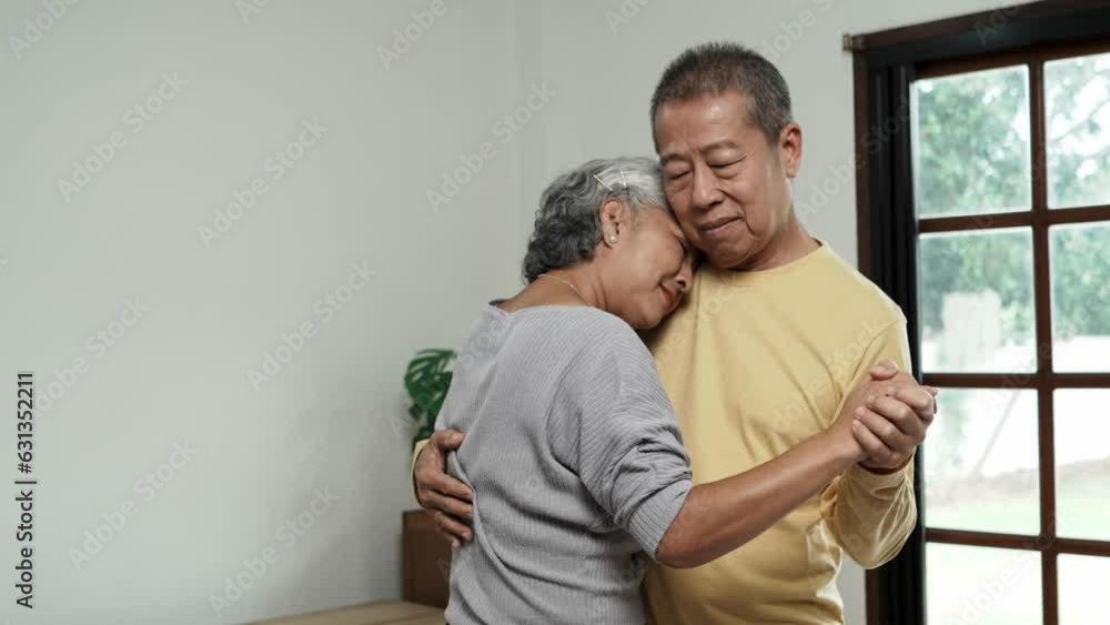 Happy romantic middle aged older retired family couple dancing slowly to favorite music. Happy romantic middle aged older retired family couple dancing slowly to favorite music.