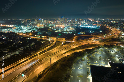 View from above of american big freeway intersection in Tampa  Florida at night with fast moving cars and trucks. USA transportation infrastructure concept