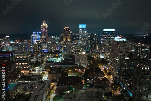 View from above of brightly illuminated high skyscraper buildings in downtown district of Atlanta city in Georgia  USA. American megapolis with business financial district at night