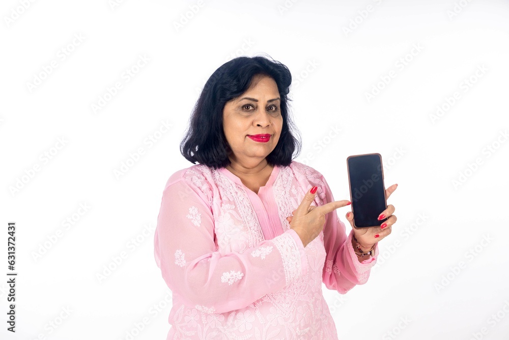 Indian woman showing smartphone screen on white background. Indian woman showing smartphone screen on white background.