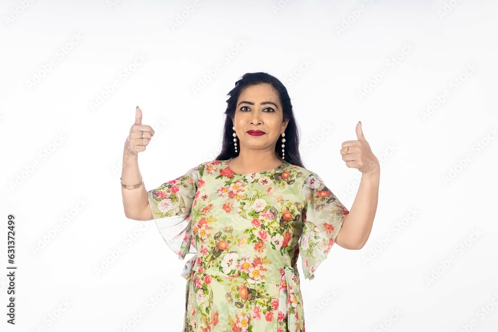 Indian woman showing thumbs up on white background. Indian woman showing thumbs up on white background.