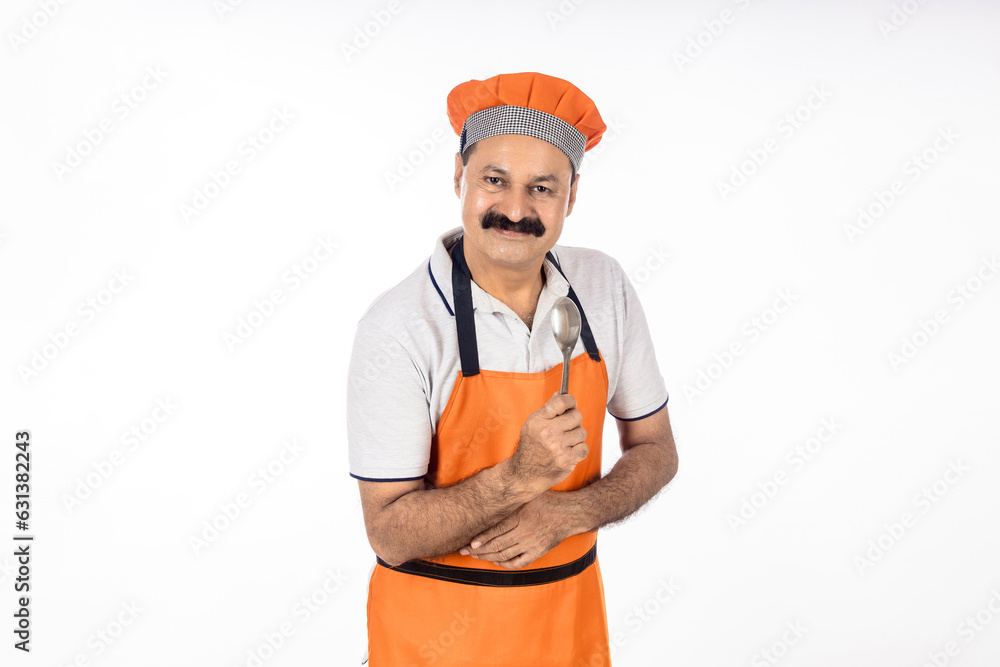 indian cook giving happy expression on white background. indian cook giving happy expression on white background.