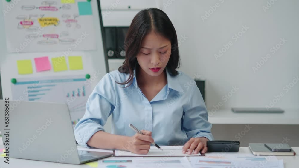 Tired young business woman feeling exhausted, having a headache after working for a long day at her office room. Tired young business woman feeling exhausted, having a headache after working for a long day at her office room.