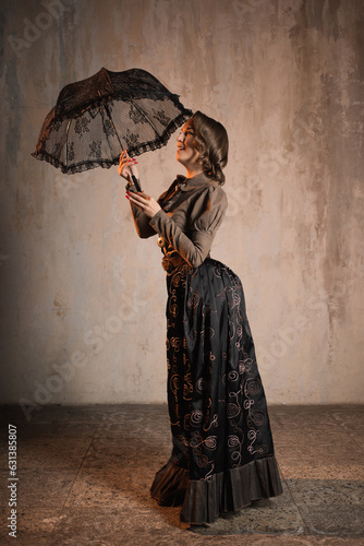 A stylish lady in an elegant suit in the Victorian style, a suit in the style of Mary Poppins, a kind teacher photo