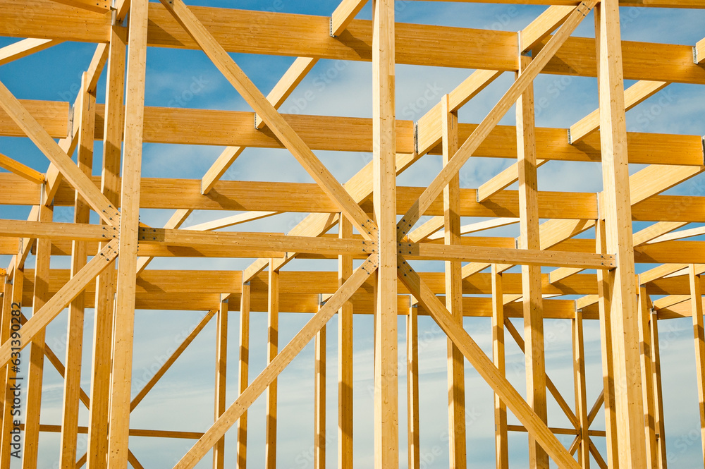 construction of a building made of wood in the background blue sky construction of a building made of wood in the background blue sky