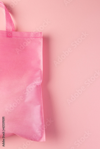 Close up of pink canvas bag with copy space on pink background