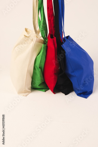 Multi colour canvas bags with copy space on white background