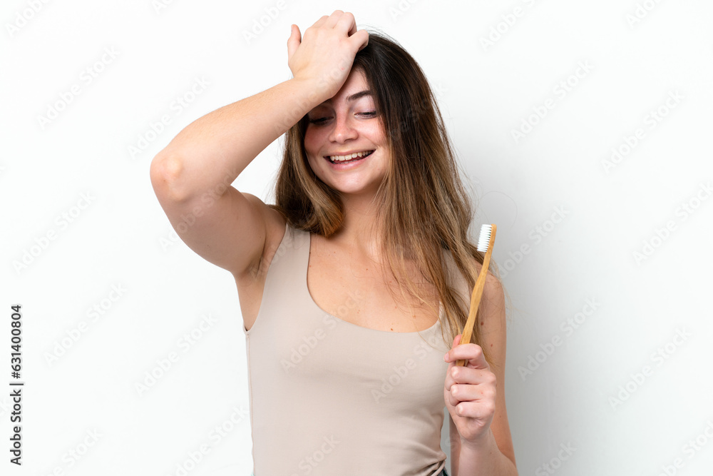 Young caucasian woman brushing teeth isolated on white background has realized something and intending the solution Young caucasian woman brushing teeth isolated on white background has realized something and intending the solution