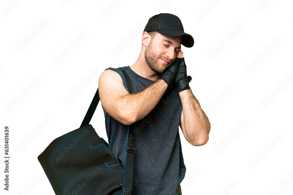 Young sport man with sport bag over isolated chroma key background making sleep gesture in dorable expression Young sport man with sport bag over isolated chroma key background making sleep gesture in dorable expression