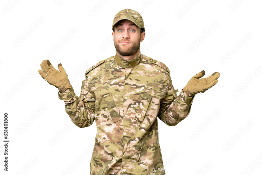 Military man over isolated chroma key background having doubts while raising hands Military man over isolated chroma key background having doubts while raising hands