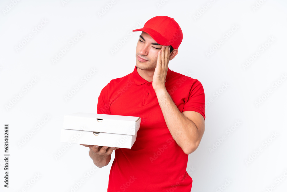 Pizza delivery caucasian man with work uniform picking up pizza boxes isolated on white background with headache Pizza delivery caucasian man with work uniform picking up pizza boxes isolated on white background with headache