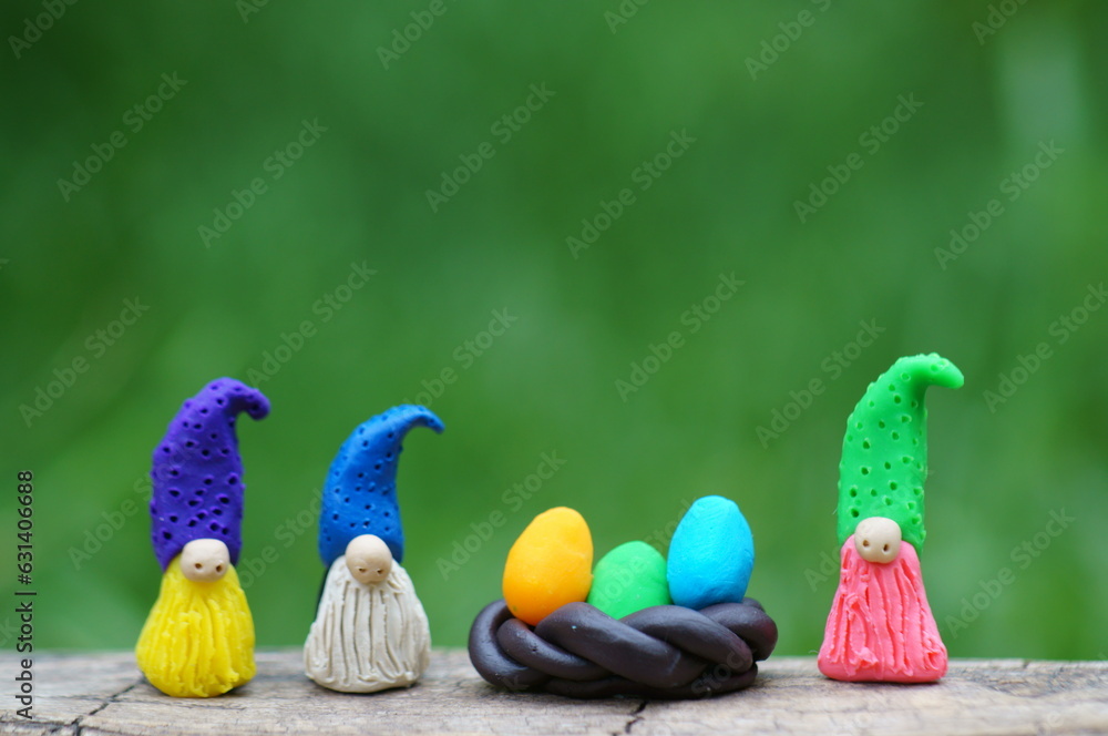 Figurines of fairy gnomes with Easter eggs.